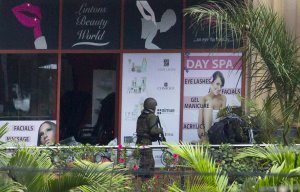 A Kenyan soldier prepares to enter the Westgate Mall, …