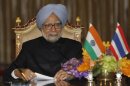 India's PM Singh speaks during a news conference at the Government House in Bangkok