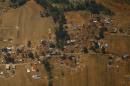Collapsed and damaged houses are pictured from a helicopter after last week's earthquake at Sindhupalchok District