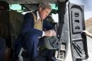 U.S. Secretary of State John Kerry waits in a helicopter in Baghdad