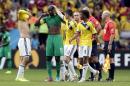 Colombia players console Ivory Coast's Yaya Toure after the group C World Cup soccer match between Colombia and Ivory Coast at the Estadio Nacional in Brasilia, Brazil, Thursday, June 19, 2014. Colombia won the match 2-1. (AP Photo/Marcio Jose Sanchez)