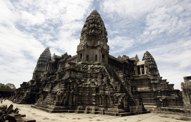 In this photo taken on June 28, 2012, Cambodia's famed Angkor Wat temples complex stands in Siem Reap province, some 230 kilometers (143 miles) northwest Phnom Penh, Cambodia. Airborne laser technology has uncovered a network of roadways and canals, illustrating a bustling ancient city linking Cambodia's Angkor Wat temples complex. The discovery was announced late Monday, June 17, 2013, in a peer-reviewed paper released early by the journal Proceedings of the National Academy of Sciences. (AP Photo/Heng Sinith)