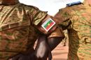 Burkinabe troops stand guard in Ouagadougou on October 31, 2014