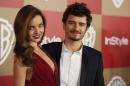 FILE - In this Jan. 13, 2013 file photo, Miranda Kerr and Orlando Bloom arrive at the InStyle and Warner Bros. Golden Globe After Party at the Beverly Hilton Hotel in Beverly Hills, Calif. Bloom and Kerr confirmed the end of their marriage Friday, Oct. 25, 2013, saying they have been 