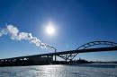 Steam is seen drifting from a factory over the Hoan Bridge as another round of arctic air blasts the midwest keeping the wind chill in the negative numbers, in Milwaukee, Wisconsin
