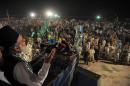 Syed Munawar Hassan, chief of Jamaat-e-Islami party addresses supporters during an election meeting in Peshawar on May 7, 2013