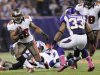 Tampa Bay Buccaneers running back Doug Martin, left, runs from Minnesota Vikings strong safety Jamarca Sanford during the first half of an NFL football game Thursday, Oct. 25, 2012, in Minneapolis. (AP Photo/Jim Mone)