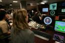 Experts work at the Threat Operations Center inside the National Security Agency (NSA) in suburban Fort Mead, Maryland on January 25, 2006