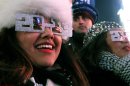 Alexandra Esquivel, left, and her aunt Anna Ramos, right, both from Arizona, attend the New Year's Eve festivities in New York's Times Square on Monday, Dec. 31, 2012. (AP Photo/Tina Fineberg)