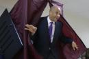 Newark Mayor Cory Booker walks out of a polling booth after casting his vote in a special election for the vacant New Jersey seat in the U.S. Senate, Wednesday, Oct. 16, 2013, in Newark, N.J. Booker is going up against Republican Steve Lonegan. (AP Photo/Julio Cortez)