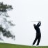 Tiger Woods hits his second shot on the 14th fairway of the north course at Torrey Pines Golf Course during the second round of the Farmers Insurance Open golf tournament Friday, Jan. 25, 2013, in San Diego. (AP Photo/Gregory Bull)