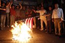 Protesters burn a U.S. flag during a protest against a film produced in the U.S. that they said that was insulting to the Prophet Mohammad in Istanbul