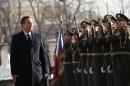 British Prime Minister David Cameron inspects a guard of honor upon his arrival in Prague, Czech Republic, Friday, Jan. 22, 2016. Britain's prime minister arrived to Prague in efforts to win support from Czech leaders for his government's demands for European Union reform.(AP Photo/Petr David Josek)