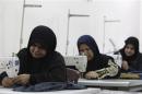 File photo shows widows working on sewing machines at a widows' training and development centre in Baghdad
