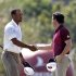 Tiger Woods shakes hands with Rory McIlroy after their World Golf Final Group 1 match in Antalya
