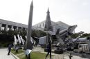 FILE - In this Monday, May 20, 2013 file photo, a mock Scud-B missile of North Korea, left, and other South Korean missiles are displayed at the Korea War Memorial Museum in Seoul, South Korea. South Korea says Thursday, Feb. 27, 2014, North Korea has fired 4 suspected short-range missiles into eastern waters. (AP Photo/Lee Jin-man)
