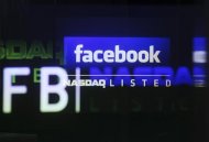 The Facebook logo is seen on a screen inside at the Nasdaq Marekstsite in New York May 18, 2012. REUTERS/Shannon Stapleton