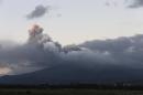 A view of Cotopaxi volcano spewing ashes as seen from Latacunga, Ecuador, Saturday, Aug. 15, 2015. The Cotopaxi volcano near Ecuador's capital has spewed ash over a wide area in pre-dawn blasts. The volcano is considered one of the world's most dangerous volcanoes due to a glacial cover that makes it prone to mud flows and its proximity to a heavily populated area, but government scientists say that the snow-capped volcano doesn't seem to be on the verge of a major eruption. Its last major eruption was in 1877. (AP Photo/Dolores Ochoa)