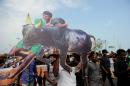 People shout slogans and hold placards during a demonstration against the ban on the Jallikattu bull taming ritual, and calling for a ban on animal rights orgnisation PETA in Chennai on January 19, 2017