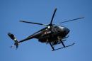 A military helicopter overflies Buenavista-Tomatlan, Michoacan State, Mexico, on January 14, 2014
