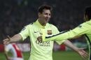 Barcelona's Lionel Messi celebrates scoring his side's 2nd goal during the Group F Champions League match between AFC Ajax and FC Barcelona at ArenA stadium in Amsterdam, Netherlands, Wednesday, Nov. 5, 2014. (AP Photo/Peter Dejong)