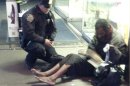 Handout photo of NYPD officer DePrimo giving boots to a homeless man in New York