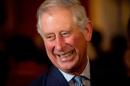 Britain's Prince Charles reacts to a comment as he meets guests during a reception in Clarence House, central London on October 24, 2013