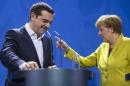 File photo of German Chancellor Merkel and Greek Prime Minister Tsipras leaving after addressing news conference in Berlin