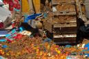 A worker uses a bulldozer to crush crates of peaches outside the city of Novozybkov, Russia, on August 7, 2015