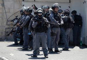 Israeli policemen stand guard during clashes on April &hellip;