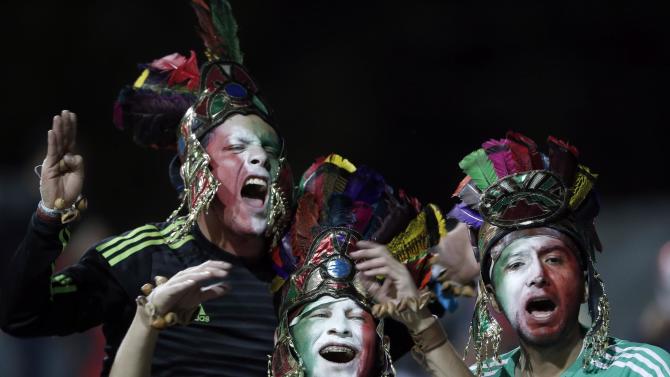 Mexican fans cheer before a Copa America Group A soccer match between Mexico and Bolivia at the Sausalito Stadium in Vina del Mar, Chile, Friday, June 12, 2015. (AP Photo/Silvia Izquierdo)