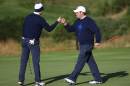 Jordan Spieth, left, and Patrick Reed, right, of the US celebrate on the 6th green during the fourball match on the first day of the Ryder Cup golf tournament, at Gleneagles, Scotland, Friday, Sept. 26, 2014. (AP Photo/Scott Heppell)
