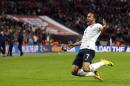 England's Andros Townsend celebrates scoring his team's third goal during their World Cup 2014 Group H qualifying football match against Montenegro at Wembley Stadium in north London on October 11, 2013