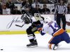 Pittsburgh Penguins' Sidney Crosby (87) gets past New York Islanders' Thomas Hickey (14) on a breakaway for a goal in the second period of Game 5 of an NHL hockey Stanley Cup first-round playoff series, Thursday, May 9, 2013, in Pittsburgh. (AP Photo/Gene J. Puskar)