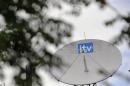 A satellite dish is seen on the roof of ITV television studios in London