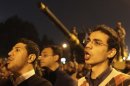 Protesters opposing President Mursi shout slogans during a demonstration in Cairo