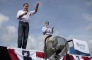 Republican presidential candidate, former Massachusetts Gov. Mitt Romney, accompanied by his vice presidential running mate Rep. Paul Ryan, R-Wis. speaks during a campaign stop, Friday, Aug. 31, 2012, in Lakeland, Fla. (AP Photo/Evan Vucci)