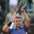 Wawrinka of Switzerland celebrates defeating Gasquet of France in their men's singles match at the French Open tennis tournament in Paris
