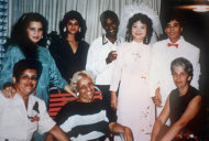 In this 1992 photo provided by Phan Thi Kim Phuc shows her, top row second from right, and her husband Bui Huy Toan, top row right, with guests during their wedding day in Havana, Cuba. It only took a second for Associated Press photographer Nick Ut to snap the iconic black-and-white image of her after a napalm attack in 1972. It communicated the horrors of the Vietnam War in a way words could never describe, helping to end one of America's darkest eras. But beneath the photo lies a lesser-known story. It's the tale of a dying child brought together by chance with a young photographer. A moment captured in the chaos of war that would serve as both her savior and her curse on a journey to understand life's plan for her. (AP Photo/Courtesy Phan Thi Kim Phuc)