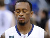 Connecticut's Ryan Boatright participates in a moment of silence honoring those killed in a school shooting in Newtown, Conn., last Friday. The service was held before an NCAA college basketball game between Connecticut and Maryland Eastern Shore in Hartford, Conn., Monday, Dec. 17, 2012. (AP Photo/Fred Beckham)