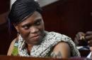Former Ivorian first lady Simone Gbagbo looks on at Abidjan's courthouse on October 10, 2016 before the re-opening of her trial, which her lawyers said October 24, 2016 they would refuse to participate in "until further notice"
