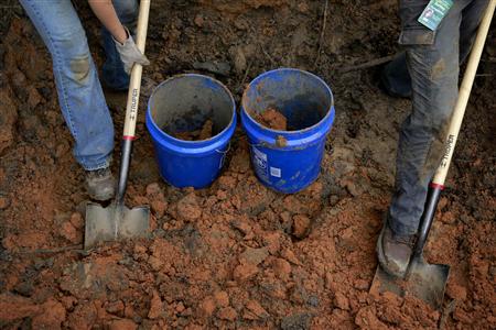A team of anthropologists from the University of South Florida are exhuming suspected graves at the Boot Hill cemetery at the now closed Arthur G. Dozier School for Boys in Marianna, Florida, August 31, 2013. REUTERS/Edmund D Fountain/Pool