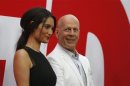 Cast member Willis and his wife Heming pose at the premiere of the film "Red 2" in Los Angeles