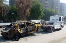 Coche dañado por la explosión en la plaza Fardaús de Bagdad