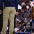 Louisville Cardinals hold hands with Kevin Ware after he broke his leg against Duke during their Midwest Regional NCAA men's basketball game in Indianapolis