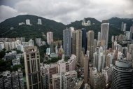 Photo taken on August 13 shows high rises in Hong Kong, including Opus Hong Kong (4th L on the left hill). An apartment in Opus Hong Kong has been sold for a record $61 million, making it the priciest condominium in the Chinese city and possibly the second most expensive in the world, reports said