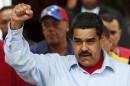 Venezuela's President Maduro gestures while he attends a rally against the opposition's amnesty law at Miraflores Palace in Caracas