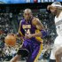 Los Angeles Lakers guard Kobe Bryant, left, works the ball inside for a shot past Denver Nuggets forward Al Harrington in the first quarter of Game 4 of the teams' first-round NBA  basketball series in Denver on Sunday, May 6, 2012. (AP Photo/David Zalubowski)