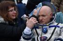 Sore, but no taller, astronaut Scott Kelly adjusts to Earth