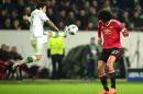 Wolfsburg's Portuguese striker Vieirinha (L) vies with Manchester United's Belgian midfielder Marouane Fellaini during the UEFA Champions League Group B second-leg football match in Wolfsburg, central Germany, on December 8, 2015